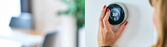 femme réglant la température du chauffage